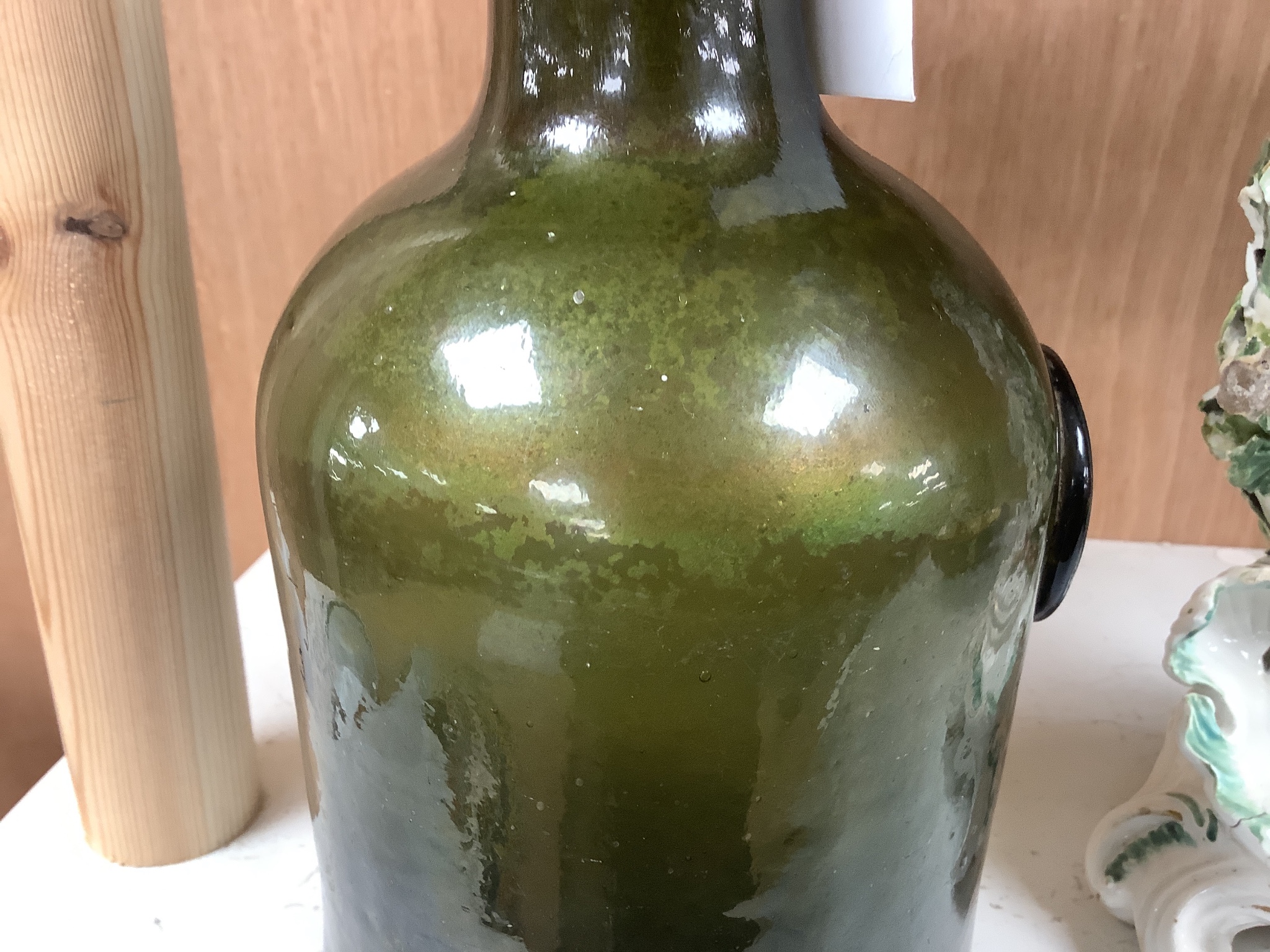 A George III green glass sealed wine bottle, dated 1778 26cm